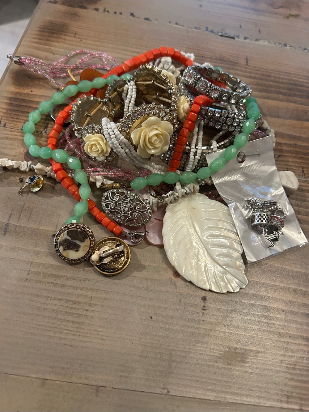 Various costume jewelry includes bracelets, necklaces, pins, earrings